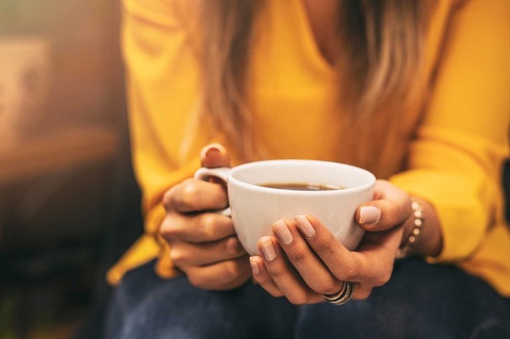 Girl Drinking a Hot Drink and sunshine